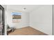 Light and airy bedroom with wood floors and a window at 6268 S Martingale Ct, Gilbert, AZ 85298