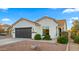 Modern single-story home with a two-car garage and well-manicured landscaping at 6268 S Martingale Ct, Gilbert, AZ 85298