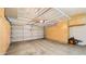 Clean and organized garage featuring overhead storage and a large door at 6268 S Martingale Ct, Gilbert, AZ 85298