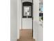 Modern hallway with a stylish mirror and built-in shelving at 6268 S Martingale Ct, Gilbert, AZ 85298