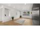 Bright living room with dark accent wall and wood floors at 6268 S Martingale Ct, Gilbert, AZ 85298