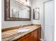 Bathroom features granite vanity and a large mirror at 7101 W Beardsley Rd # 942, Glendale, AZ 85308