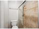 Bathroom featuring a glass shower and neutral tiling at 7101 W Beardsley Rd # 942, Glendale, AZ 85308