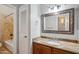 Updated bathroom featuring a decorative framed mirror and granite counters at 7101 W Beardsley Rd # 942, Glendale, AZ 85308