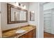 Bathroom with a granite countertop and large framed mirror at 7101 W Beardsley Rd # 942, Glendale, AZ 85308