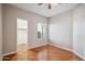 A clean bedroom with wood floors, neutral paint, and a view to the outside at 7101 W Beardsley Rd # 942, Glendale, AZ 85308