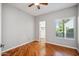 Bright bedroom with wood floors, a ceiling fan, and a large window at 7101 W Beardsley Rd # 942, Glendale, AZ 85308