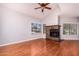 Bright living room with hardwood floors, fireplace, and vaulted ceiling at 7101 W Beardsley Rd # 942, Glendale, AZ 85308