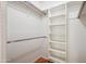 Organized walk-in closet with built-in shelving and wood flooring at 7101 W Beardsley Rd # 942, Glendale, AZ 85308