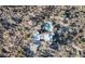 High-angle view showcasing a unique home and kidney-shaped pool at 7957 E Cave Creek Rd, Carefree, AZ 85377