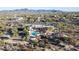 Aerial view of a sprawling estate with a pool and desert landscape at 7957 E Cave Creek Rd, Carefree, AZ 85377