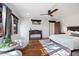 Bedroom with wood floors, white walls and two armchairs at 7957 E Cave Creek Rd, Carefree, AZ 85377