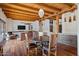 View of the dining room with hardwood floors and access to the patio at 7957 E Cave Creek Rd, Carefree, AZ 85377