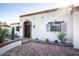 Front view of a Spanish-style home with brick patio and landscaping at 7957 E Cave Creek Rd, Carefree, AZ 85377