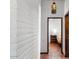 Bright hallway with whitewashed brick walls and terracotta tile flooring at 7957 E Cave Creek Rd, Carefree, AZ 85377