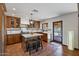 Spacious kitchen with island, custom cabinetry, and terracotta tile flooring at 7957 E Cave Creek Rd, Carefree, AZ 85377