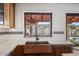 Copper farmhouse sink, white tile, and a view to the backyard at 7957 E Cave Creek Rd, Carefree, AZ 85377