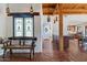 View of the living room from entryway, showing wooden beams and tiled floor at 7957 E Cave Creek Rd, Carefree, AZ 85377