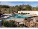 Stunning pool with fountain and mountain backdrop at 7957 E Cave Creek Rd, Carefree, AZ 85377