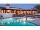 Night view of the pool area, illuminated for ambiance at 7957 E Cave Creek Rd, Carefree, AZ 85377