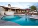 Stunning kidney-shaped pool with a fountain and patio at 7957 E Cave Creek Rd, Carefree, AZ 85377