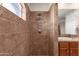 Bright bathroom with a shower stall and a tiled surround at 8137 N 13Th Pl, Phoenix, AZ 85020