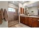 Elegant bathroom with double sinks, a large shower, and plenty of cabinet space at 8137 N 13Th Pl, Phoenix, AZ 85020