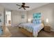 Bedroom with ceiling fan, ensuite bathroom access, and neutral decor at 8137 N 13Th Pl, Phoenix, AZ 85020