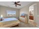 Main bedroom with ensuite bathroom access and a ceiling fan at 8137 N 13Th Pl, Phoenix, AZ 85020