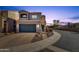 Two-story house with a dark-gray garage door and desert landscaping at 8137 N 13Th Pl, Phoenix, AZ 85020