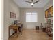 Home office with a wood desk, comfortable chair, and built-in shelving at 8137 N 13Th Pl, Phoenix, AZ 85020