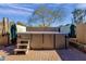 Spacious backyard hot tub with wooden steps and privacy cover at 8137 N 13Th Pl, Phoenix, AZ 85020