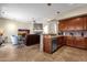 Kitchen with wood cabinets, granite counters, and stainless steel appliances at 8137 N 13Th Pl, Phoenix, AZ 85020