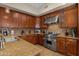 Spacious kitchen with wood cabinets, granite counters and stainless steel appliances at 8137 N 13Th Pl, Phoenix, AZ 85020