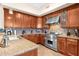 Modern kitchen featuring wood cabinets and granite countertops at 8137 N 13Th Pl, Phoenix, AZ 85020