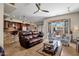 Open living room and kitchen with a brown leather sofa at 8137 N 13Th Pl, Phoenix, AZ 85020