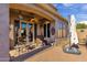 Covered patio with seating area, ceiling fan, and paver stones at 8137 N 13Th Pl, Phoenix, AZ 85020