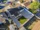 Aerial view of a house with a backyard, showcasing a grassy area and surrounding homes at 8230 W Monterey Way, Phoenix, AZ 85033