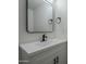 Clean bathroom with vanity, mirror, and modern fixtures at 8230 W Monterey Way, Phoenix, AZ 85033