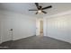 Well-lit bedroom, featuring ceiling fan and double door closet at 8230 W Monterey Way, Phoenix, AZ 85033