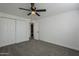 Spacious bedroom with ceiling fan and closet at 8230 W Monterey Way, Phoenix, AZ 85033