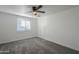 Bright bedroom with ceiling fan and window coverings at 8230 W Monterey Way, Phoenix, AZ 85033