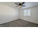 Spacious bedroom with ceiling fan and window coverings at 8230 W Monterey Way, Phoenix, AZ 85033