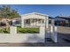 Newly renovated home with a modern facade and well-manicured lawn at 8230 W Monterey Way, Phoenix, AZ 85033