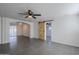 Living room showcasing gray tile floors and a rustic barn door at 8230 W Monterey Way, Phoenix, AZ 85033