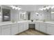 Double vanity bathroom with white cabinets and gold light fixtures at 8383 W Utopia N Rd, Peoria, AZ 85382