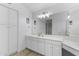 Elegant bathroom with double vanity, large mirror and white cabinets at 8383 W Utopia N Rd, Peoria, AZ 85382