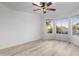 Bright bedroom with light wood floors and a ceiling fan at 8383 W Utopia N Rd, Peoria, AZ 85382