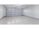 Garage with epoxy flooring and an automatic garage door at 8383 W Utopia N Rd, Peoria, AZ 85382