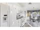 Kitchen boasts white cabinets, granite countertops and stainless steel appliances at 8383 W Utopia N Rd, Peoria, AZ 85382